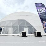 White geodesic dome beside 3x3 W Series Bangkok event flags at Chatuchak