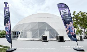 White geodesic dome beside 3x3 W Series Bangkok event flags at Chatuchak