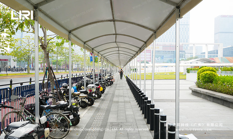 Canton Fair exhibition tent walkway cover beside parked scooters