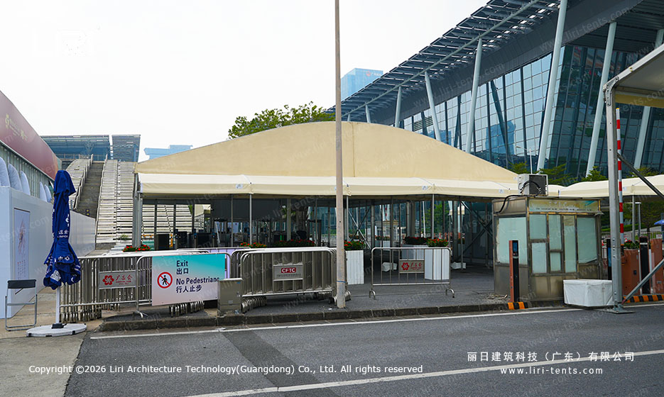 Canton Fair entrance canopy beside access-control barriers