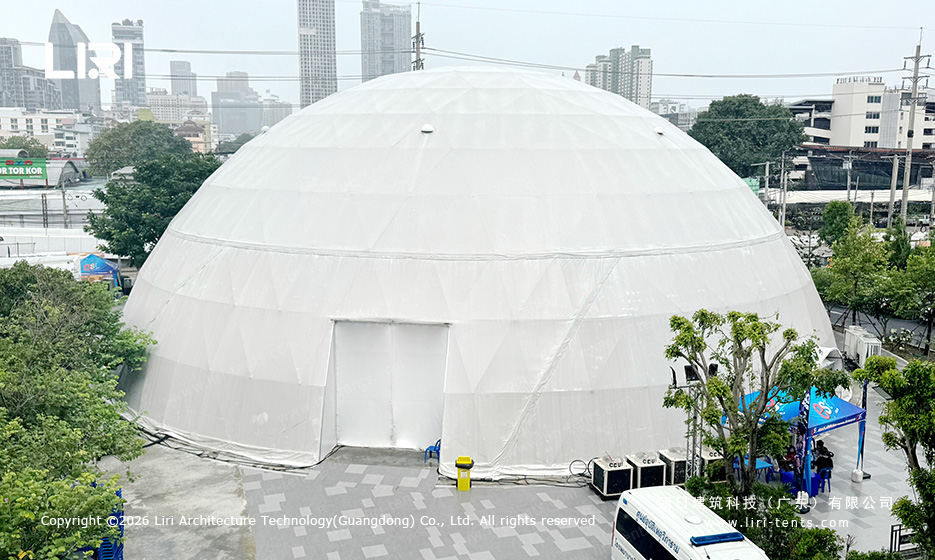 White geodesic dome installed at an urban event site in Thailand