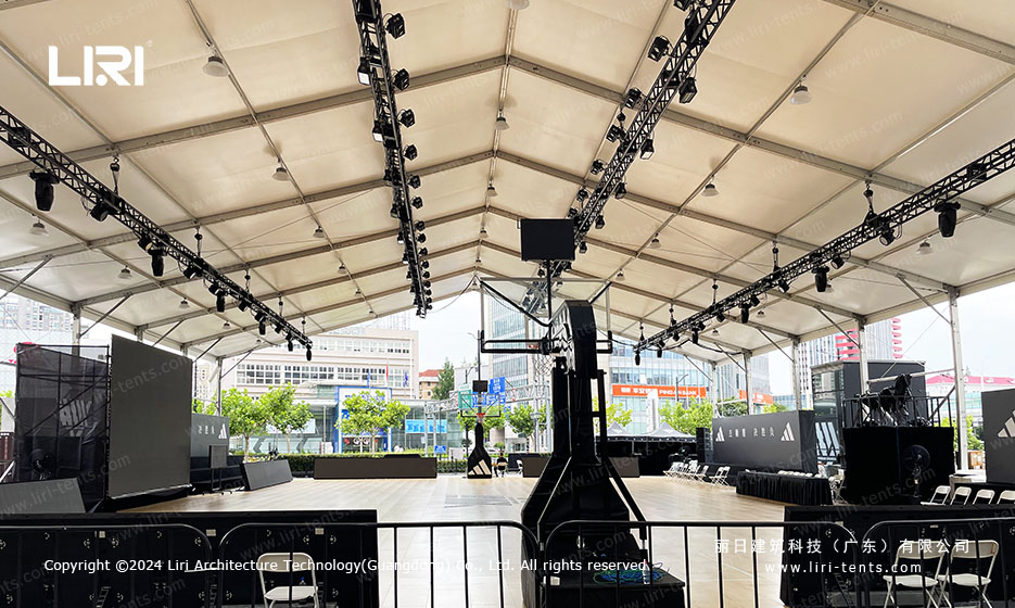 Basketball court tent with lighting truss and LED screen setup