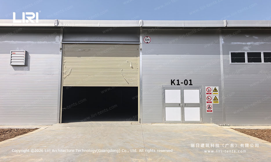 Clear span hangar tent anchored on open ground