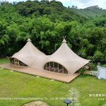 double peak tension membrane glamping tent aerial view