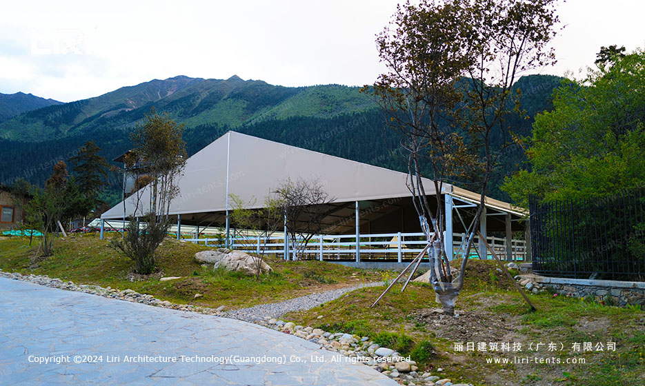 Horse riding tent entrance with mountain view