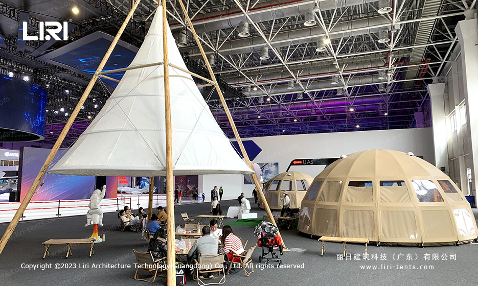 Panorama dome tent with deck chairs used as vip lounge corporate tents area
