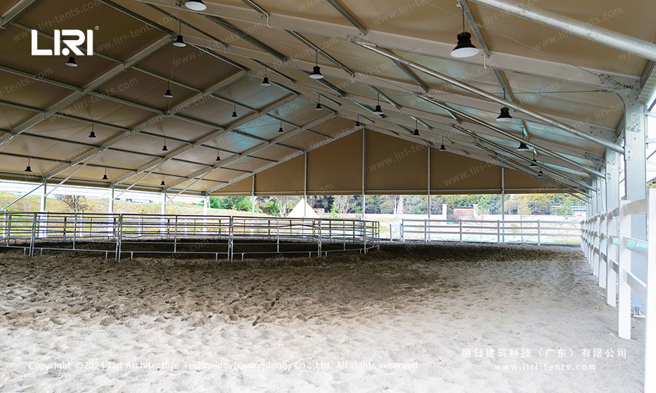 Indoor riding arena tent with sand floor and lights