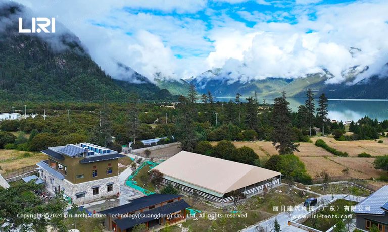 Mountain event tent aerial view over equestrian arena