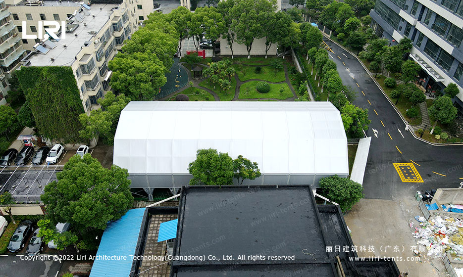 Aerial detail of curved roof multi-arch tennis court tent structure