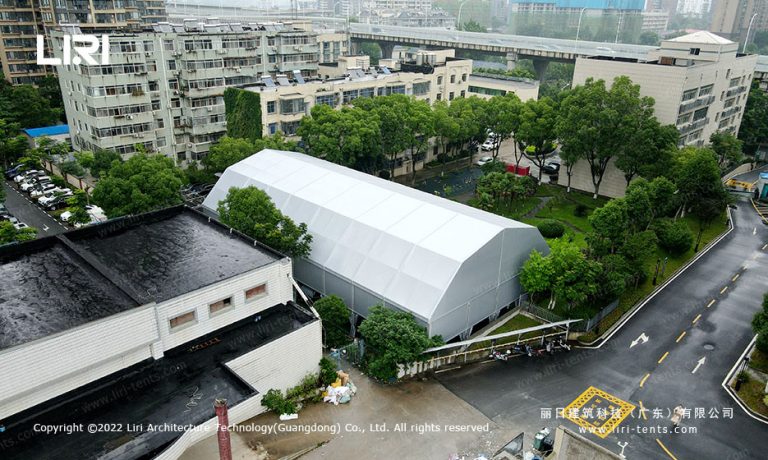 Aerial view of 18.5x36m multi-arch tennis hall tent in urban neighborhood