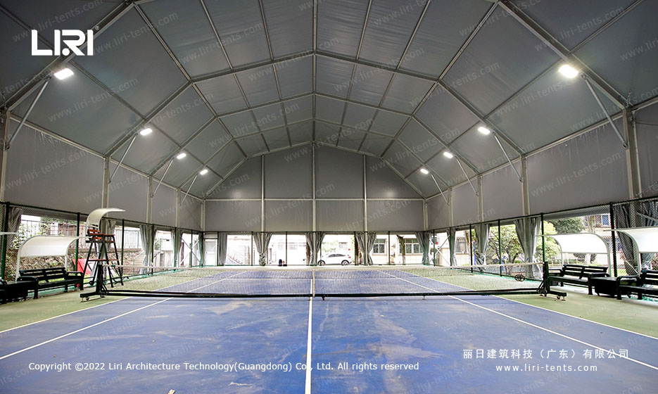 Side exterior view showing 36m length multi-arch tennis hall tent