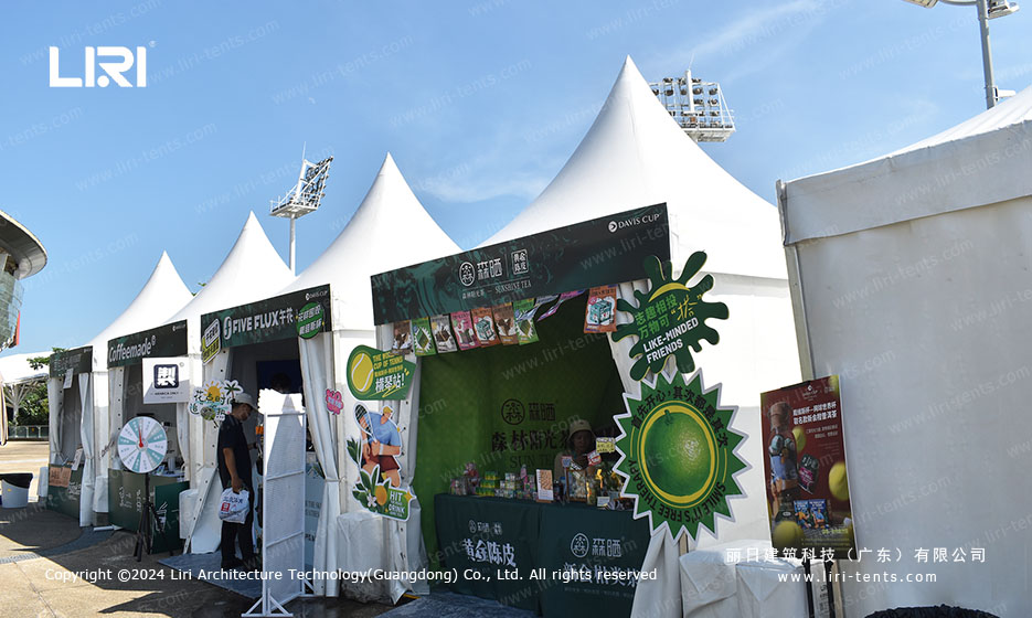White pagoda tent hosting VR tennis experience booth at sports event