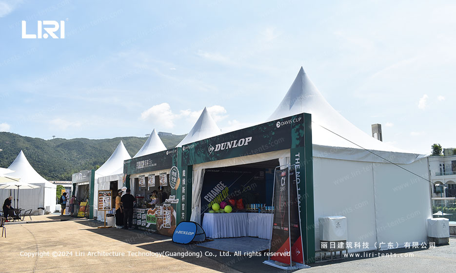 Outdoor pagoda canopy tents forming a sports activation village at tennis tournament