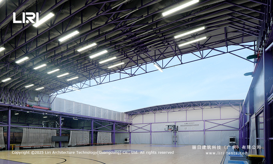 Purple aluminum frame interior with full glass wall system and training netting on a rooftop court