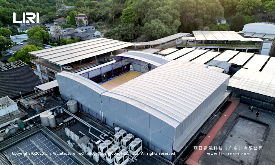 Top-down view of twin linked basketball court tent with both roof halves slid apart
