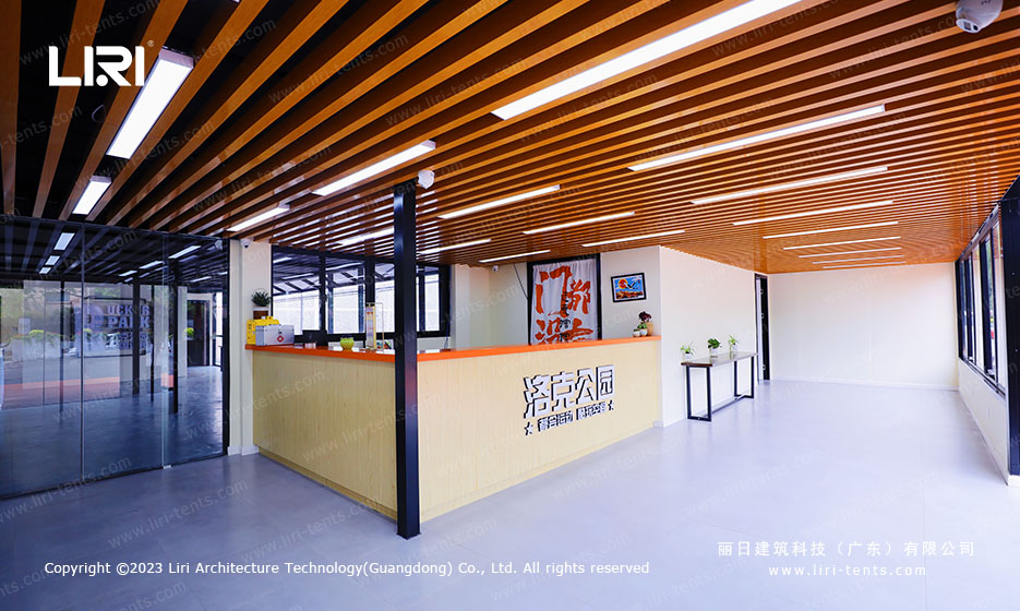 side entrance of indoor badminton court tent at Rucker Park chain venue with sliding glass door