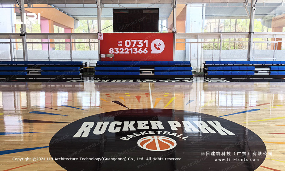 Rucker Park basketball center logo on indoor court