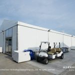 Sanya Formula E paddock event tent with golf cart in pit lane