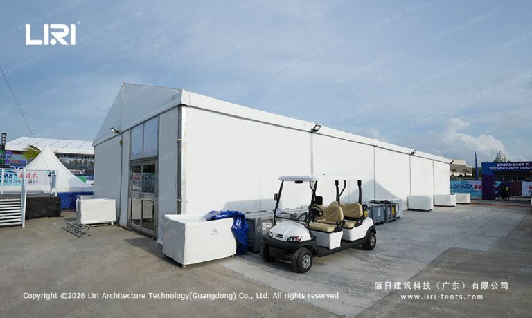 Sanya Formula E paddock event tent with golf cart in pit lane