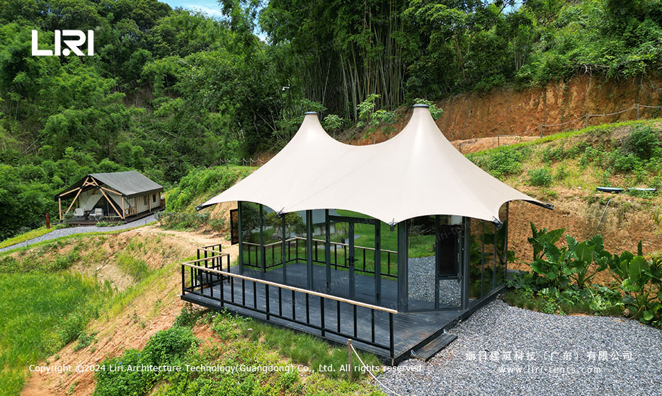 Tension membrane glamping tent with glass wall exterior