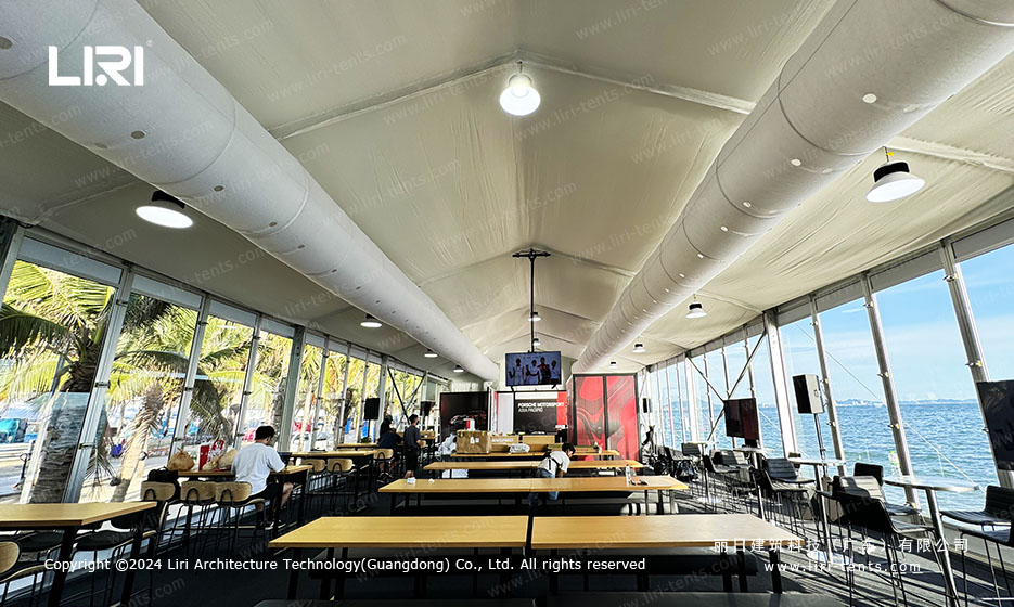 VIP lounge coffee bar area inside large event marquee at Porsche racing event