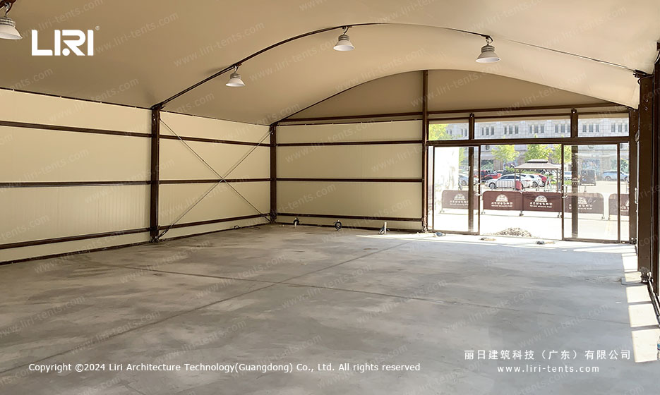 interior space of zoo tent with glass walls and concrete floor